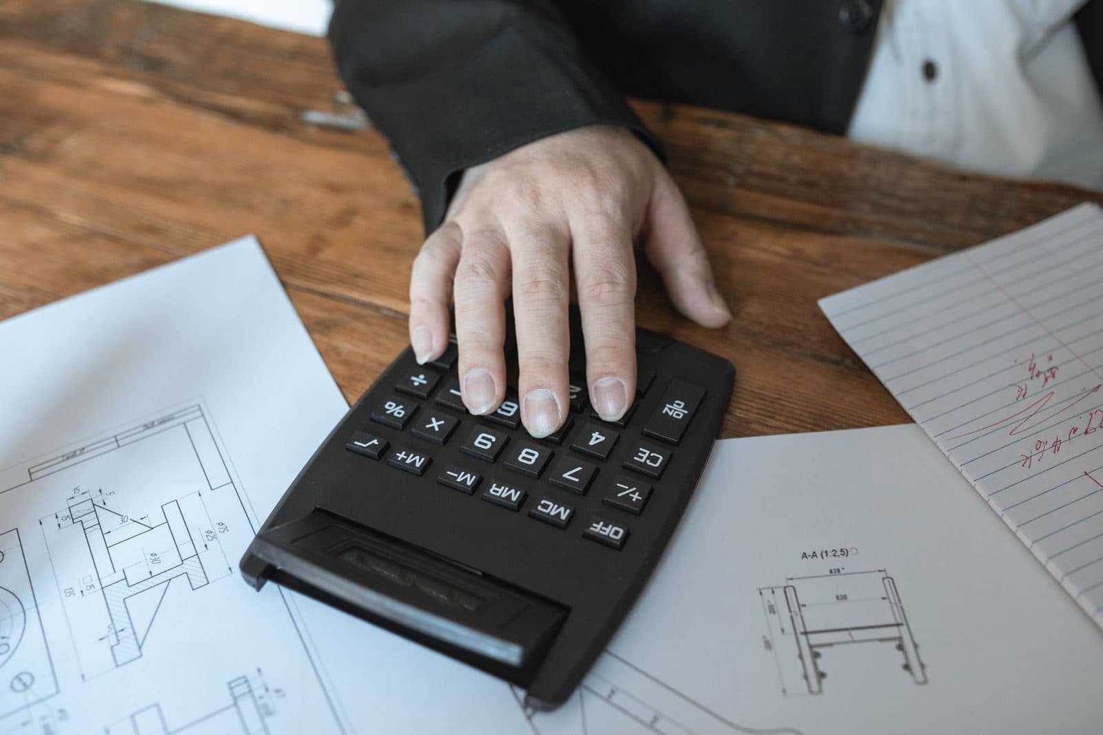 Estimator using a calculator over construction drawings