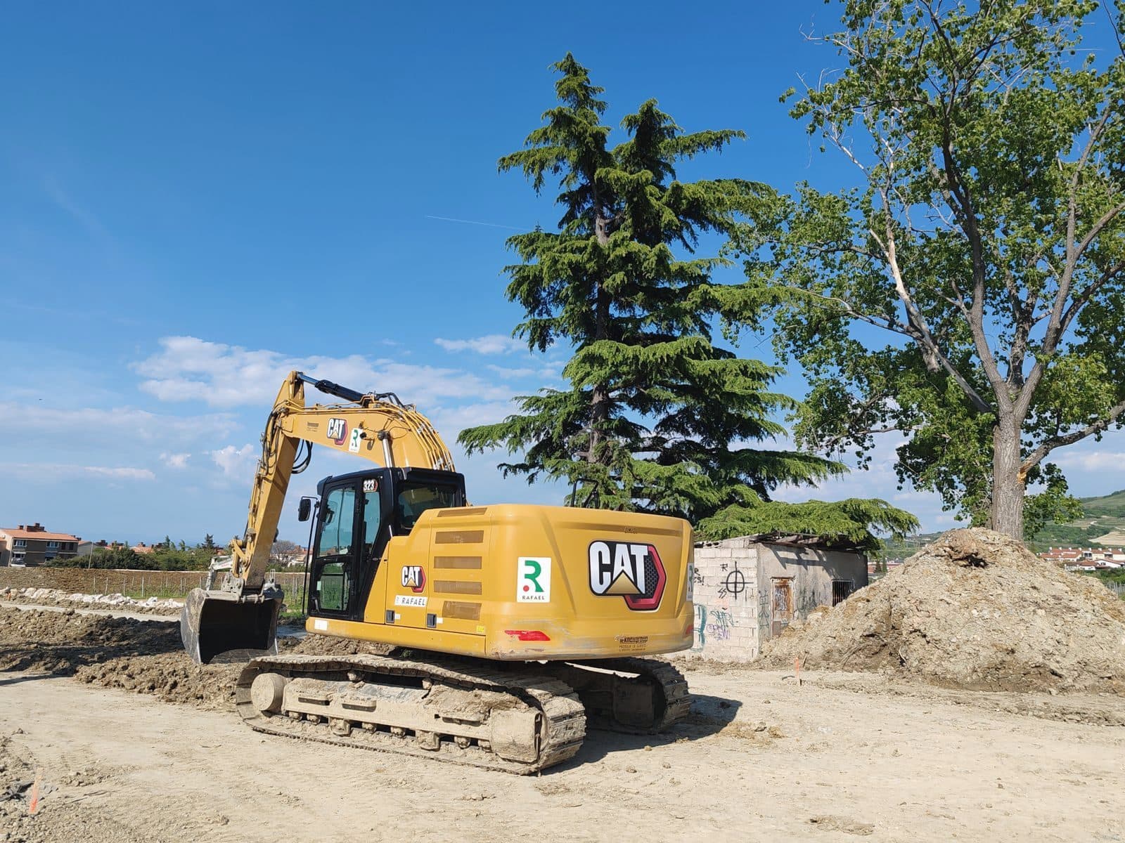 Excavator moving earth on a construction site