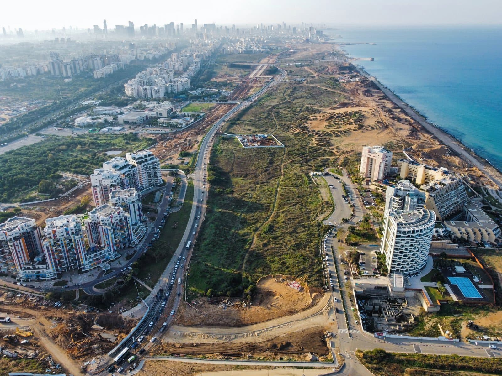 Aerial view of a growing coastal city and development land