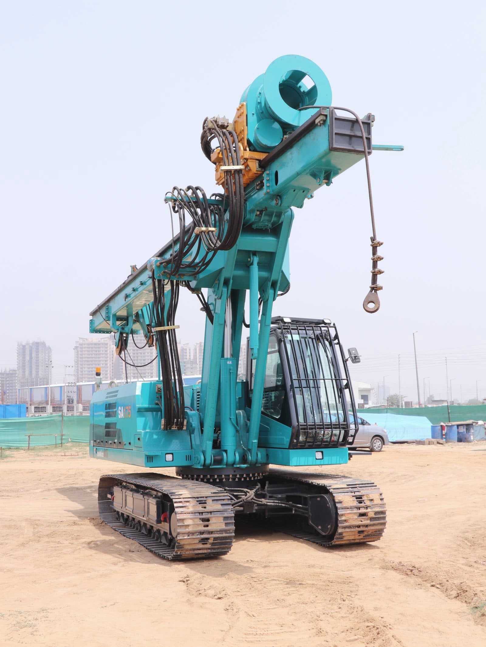 Piling rig drilling foundations on a construction site