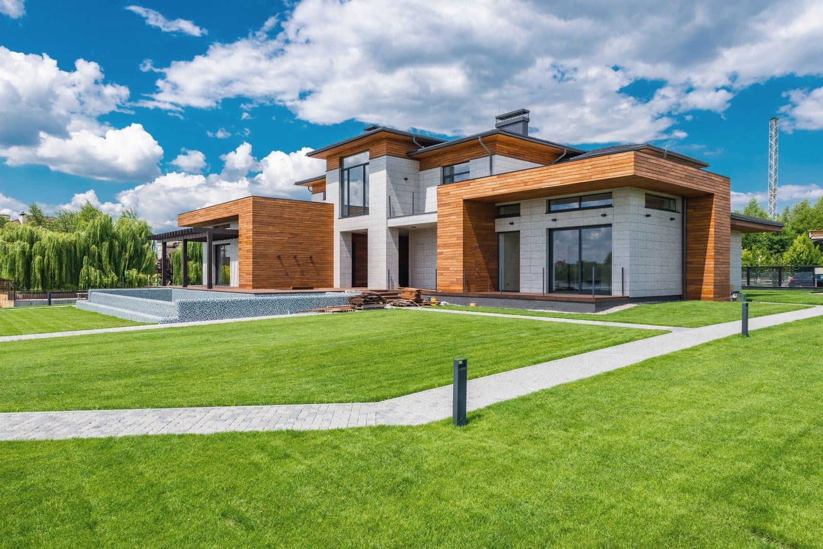 Contemporary family house with timber cladding and a lawn